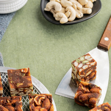 https://cdn.shopify.com/s/files/1/1857/6931/files/VellankiFoodsSugarFreeDryFruitBurfi2.jpg?v=1716899159